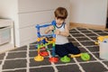 3 year old child is playing alone. Autism and misunderstandings. Concept of psychological problems Royalty Free Stock Photo