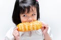 A 4 year old child was hungry, she ate the golden yellow bread with gusto