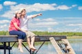 30-year-old couple resting on pier Royalty Free Stock Photo