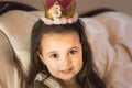 3 year old cute birthday girl with a birthday crown