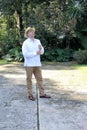 A 40-year-old dark-skinned Latin man very elegantly wears a guayabera or chabacana type shirt, widely used in Latin America