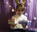 A 10-year-old European boy receives and enjoys a Christmas present
