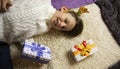 A 10-year-old European boy receives and enjoys a Christmas present