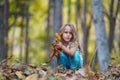 4 year old girl in an autumn forest Royalty Free Stock Photo