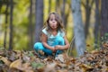 4 year old girl in an autumn forest Royalty Free Stock Photo