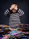 4 year old girl blocked with a lot of puzzle pieces covering her eyes with her hands