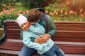 A 6 year old girl enjoying a moment of fun with her dad who is kissing her on the cheek. Royalty Free Stock Photo