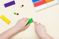A 5-year-old girl independently sculpts figures from plasticine Royalty Free Stock Photo