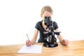 A 9-year-old girl looks into an eyepiece of a microscope and not