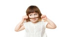 4-5 year old girl making a mustache out of hair on white background