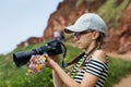 12 year old girl taking pictures in a beautiful scenic of Irish cliffs Royalty Free Stock Photo