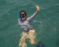 57 year-old Korean female tourist enjoying snorkeling in Santa Maria Bay near San Cabo Lucas
