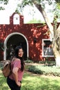 40-year-old Latina woman walks colonial streets of a Latin American town happy and relaxed enjoys the sunny day in tranquility