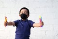 6-year-old Latino boy with covid-19 protective mouthguards, back to school with new normality Royalty Free Stock Photo