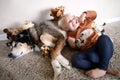 Young Child Playing with Her Pet German Shepherd Dog and Giraffe