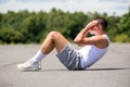 A 19 Year Old Teenage Boy Doing Situps In A Public Park Royalty Free Stock Photo