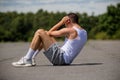 A 19 Year Old Teenage Boy Doing Situps In A Public Park Royalty Free Stock Photo