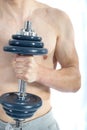 18 Year old teenage boy lifting weights Royalty Free Stock Photo