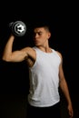 Nineteen year old teen boy exercising with a dumbbell Royalty Free Stock Photo