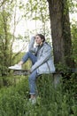 16 year old teenager sitting next to a tree in the Aragones Pyrenees. Royalty Free Stock Photo