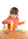 2 year old toddler stacking play doh pots Royalty Free Stock Photo