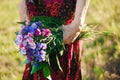 80 year old woman with a bouquet of flowers in her hands. Royalty Free Stock Photo