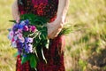 80 year old woman with a bouquet of flowers in her hands. Royalty Free Stock Photo