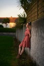 25-year-old woman with pin-up style, leaning on a stone wall Royalty Free Stock Photo