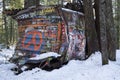 Graffiti covered train car surrounded by trees on the Whistler train wreck hike Royalty Free Stock Photo