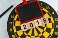 Year 2018 planning target concept with wooden blocks number 2018 on dart board with copy space