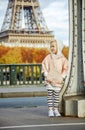 Child on Pont de Bir-Hakeim bridge in Paris looking aside