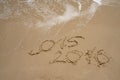 2015 and 2016 year on the sand beach Royalty Free Stock Photo