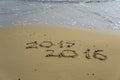 2015 and 2016 year on the sand beach Royalty Free Stock Photo