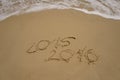 2015 and 2016 year on the sand beach Royalty Free Stock Photo