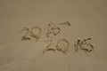 2015 and 2016 year on the sand beach Royalty Free Stock Photo