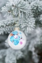 Year of the Sheep Christmas bauble on a Christmas tree branch