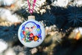 Year of the Sheep Christmas bauble on a Christmas tree branch