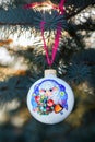 Year of the Sheep Christmas bauble on a Christmas tree branch