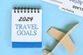 Year 2024 travel goals. Beautiful creative flat lay composition. Royalty Free Stock Photo