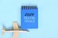 Year 2024 travel goals. Beautiful creative flat lay composition. Royalty Free Stock Photo