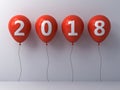 Year two thousand eighteen , Happy new year 2018 , White 2018 text on red balloons over white wall background