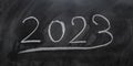 Year 2023 written on a blackboard with chalk