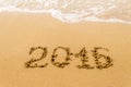 2016 Year written on sand, tropical beach. Royalty Free Stock Photo