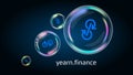 Yearn.finance YFI token symbol in soap bubble, DeFi project decentralized finance.