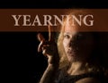 Yearning written on virtual screen. hand of young woman melancholy and sad at the window in the rain Royalty Free Stock Photo