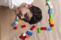 5 years adorable little kid boy playing with plastic brick toys