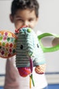 5 years adorable little kid boy playing with plush elephant toy