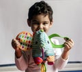 5 years adorable little kid boy playing with plush elephant toy