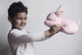 5 years adorable little kid boy playing with plush rabbit bunny toy