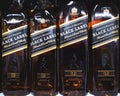 The 12 years aged blended scotch whisky Johnie Walker R Black Label, bottles at sale Royalty Free Stock Photo